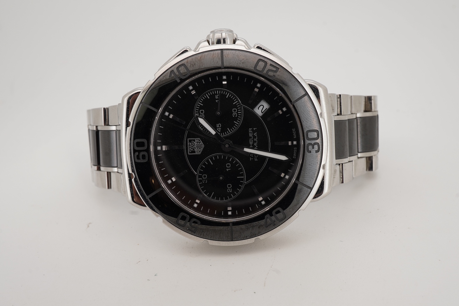 A gentleman's 2011 stainless steel TAG Heuer Formula One quartz chronograph wrist watch, on a stainless steel Tag Heuer bracelet